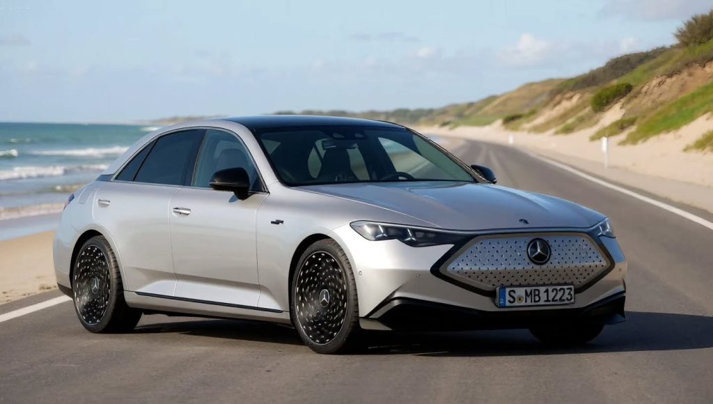2027-mercedes-benz-c-class-has-alternate-starry-design-though-only-for-imagination-land-259358_1 | Wagner Certified Collision Silver Mercedes sedan parked on a coastal road, with the sea on the left and sand dunes in the background, front three-quarter view.